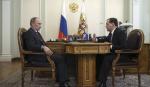 Putin i Medvedev za stolom