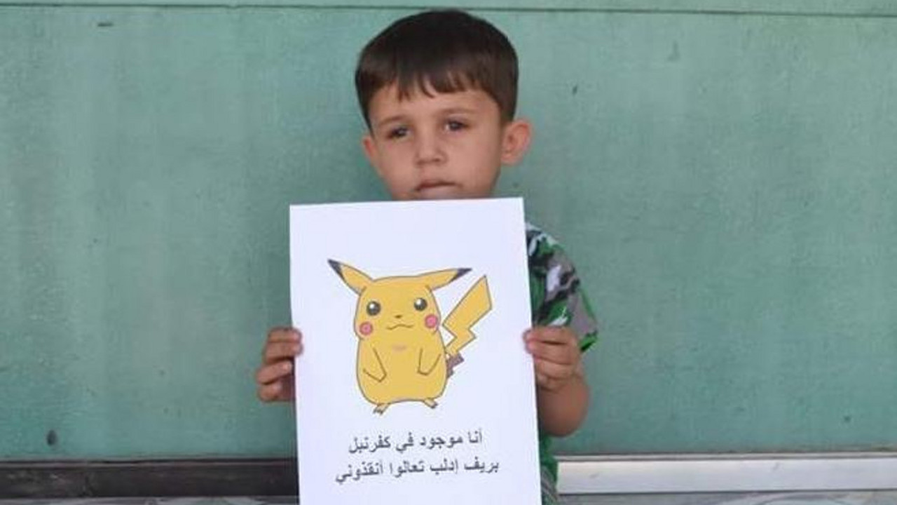 Tužno sirijsko dete sa crtežom pokemona
