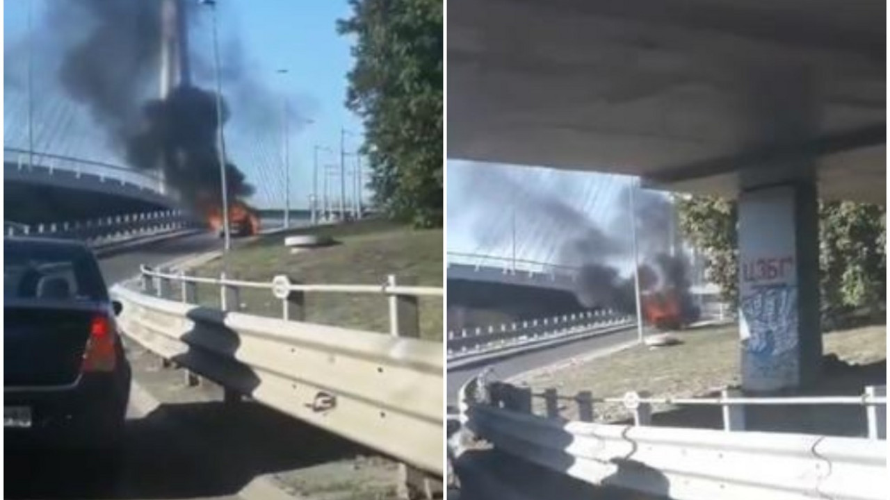 Auto u plamenu na mostu na Adi