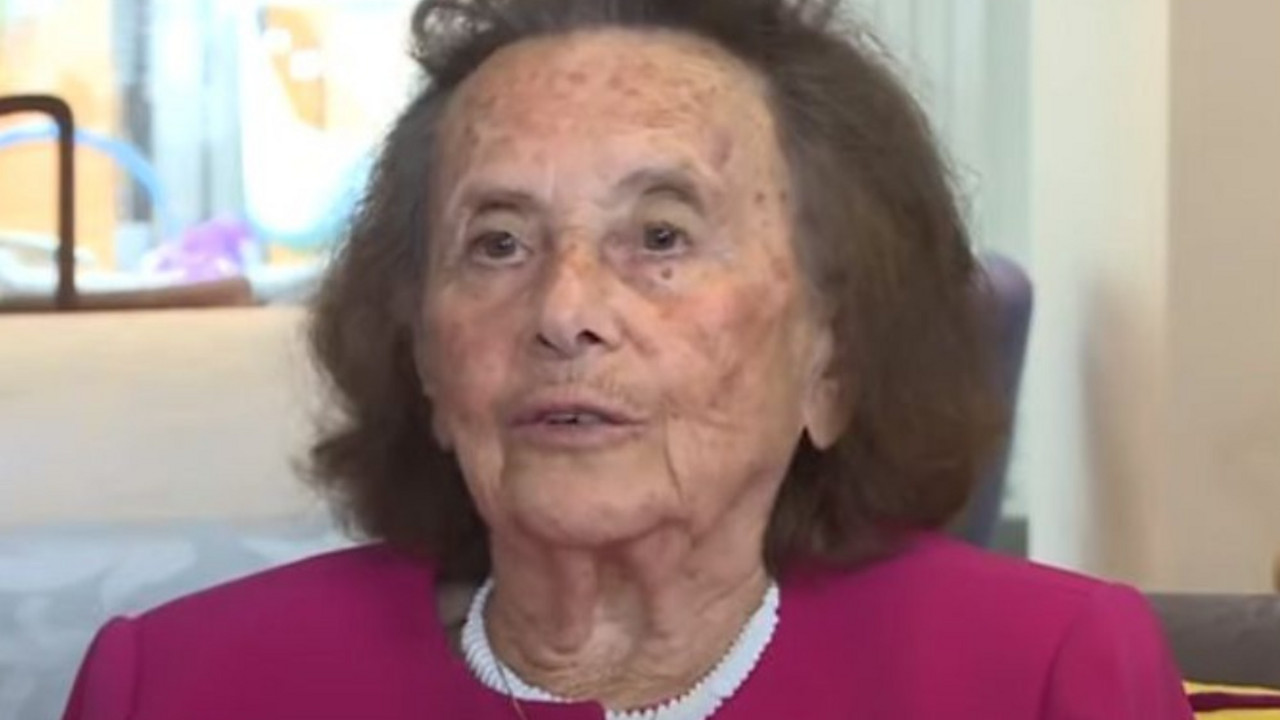 žena